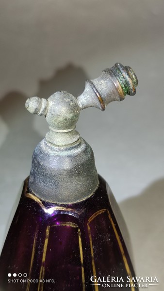 Do you wash an antique perfume bottle with a pewter attachment?