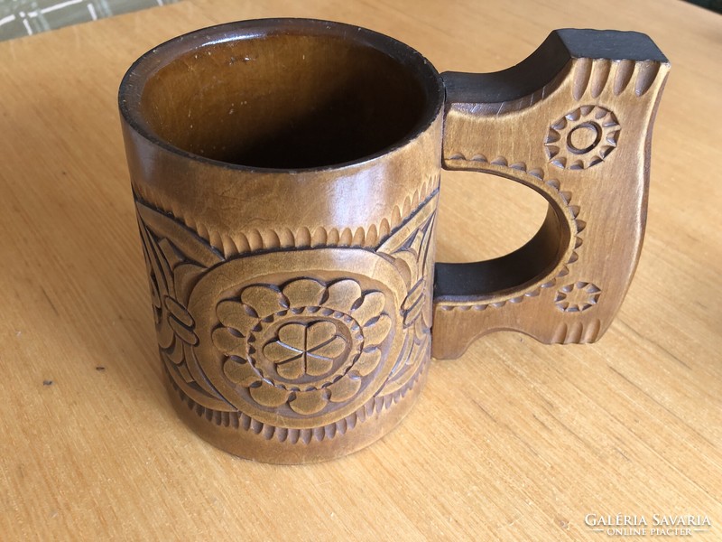 Carved wooden jug