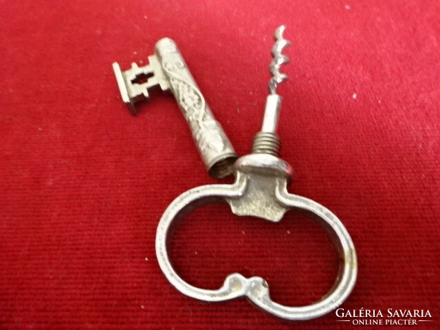 Copper bottle opener and corkscrew in the shape of a key. Jokai.
