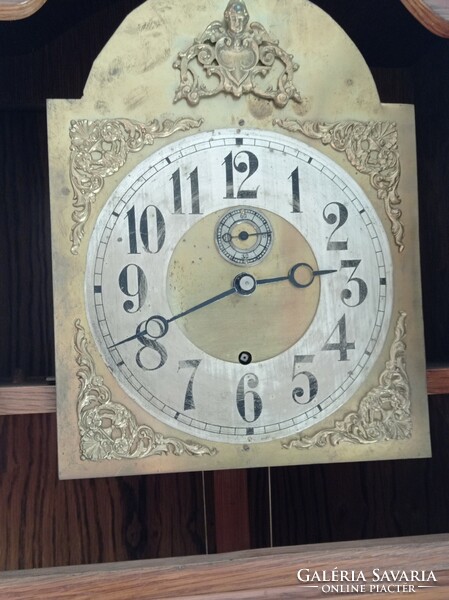 A clock in an oak case with a functioning antique clock mechanism, 2 meters long