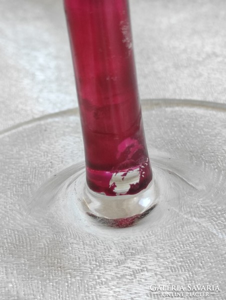 Burgundy monofilament glass candle holder.