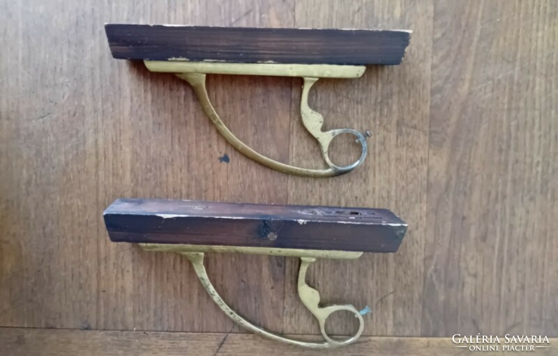 A pair of copper cornice rod holders
