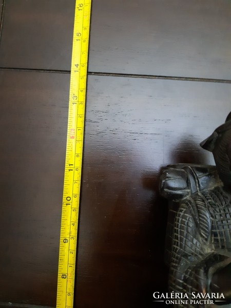 Antique solid wood statue depicting an oriental wanderer