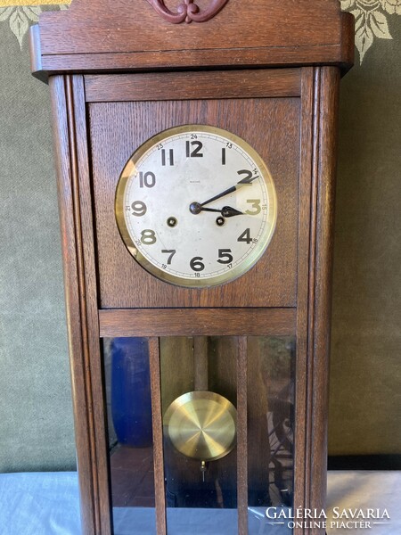 Old art deco mechanical working wall clock.