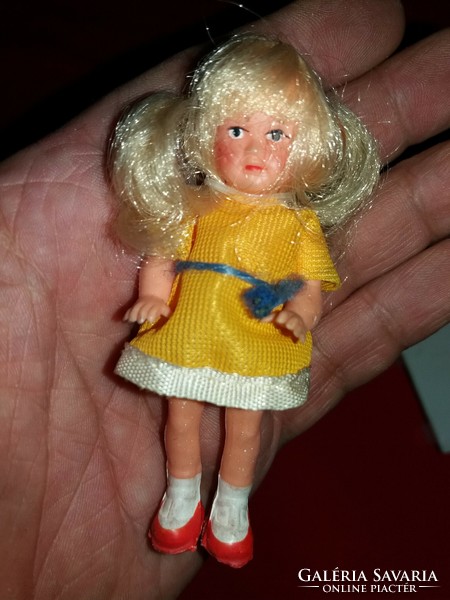Old Ari hairy rubber doll in clothes and the accompanying wooden kitchen corner settee toy as shown in the pictures