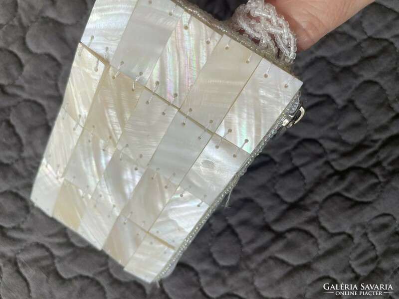 A small purse, handkerchief holder or wallet made of mother-of-pearl tiles