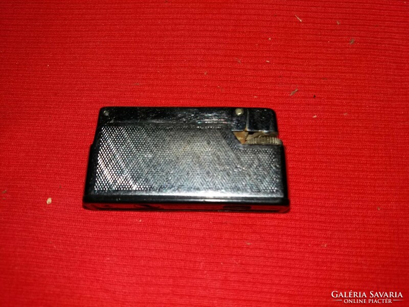 Old metal German metal Rowenta petrol lighter as shown in the pictures