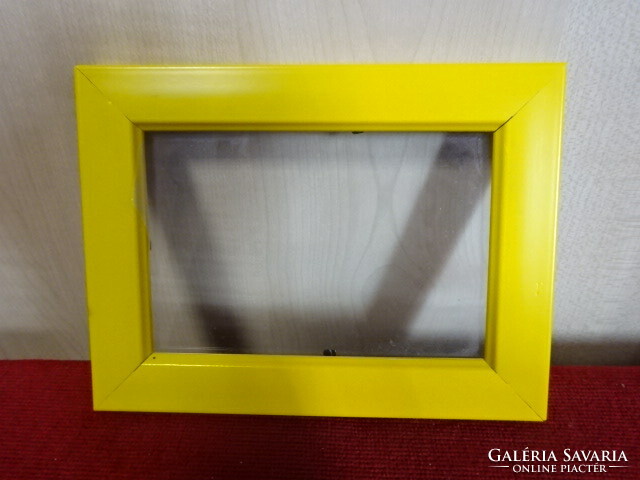 Yellow plastic picture frame with glass sheet. Jokai.
