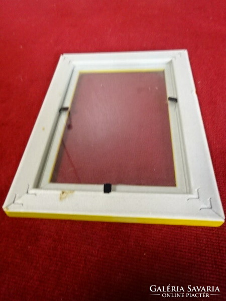 Yellow plastic picture frame with glass sheet. Jokai.