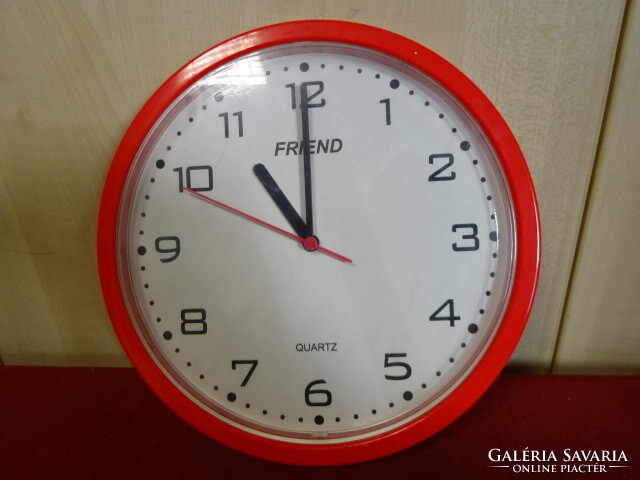 Red, plastic frame, quartz wall clock, diameter 24.5 cm. Jokai.