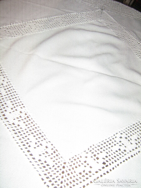 White tablecloth with beautiful handmade crochet edges and inserts