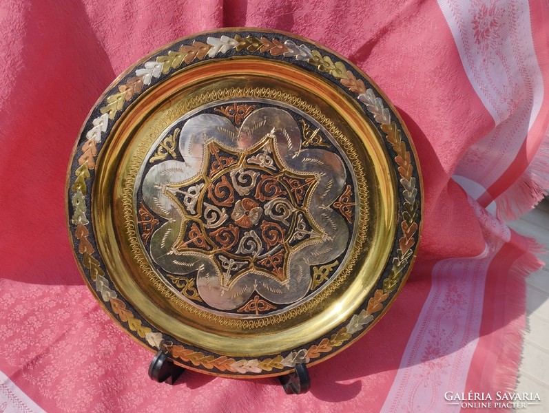Decorative, shiny, ornamental bowl with a mandala pattern
