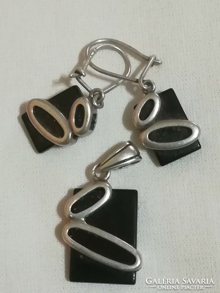 Silver earrings and pendant.