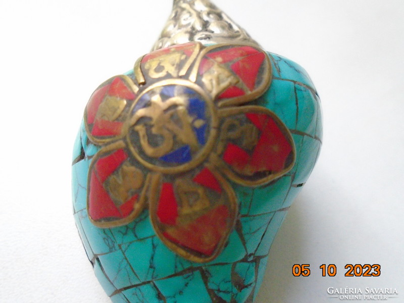 Tibetan talisman with silver and turquoise covering, applied bronze Buddhist symbols with coral and lapis stones