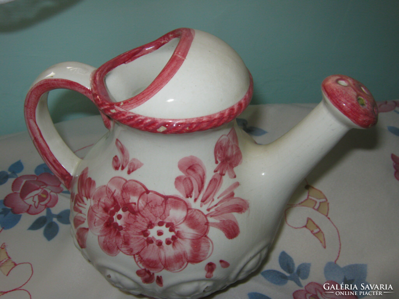 Pink ceramic watering can