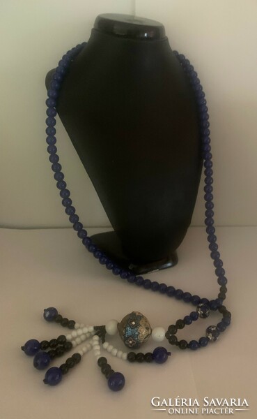 A string of beads made of painted glass beads with a lapis lazuli effect