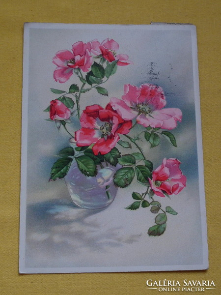 Postcard from 1952, with opened roses in a vase, with a nice stamp