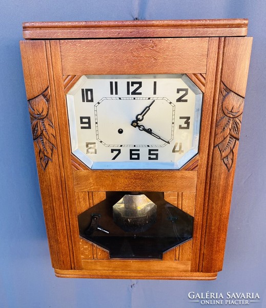 Art deco, carved wood-burning wall clock.