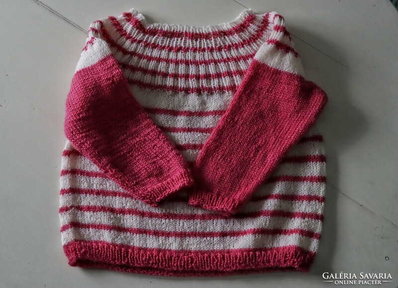 Hand-knitted baby girl sweater