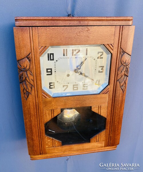 Art deco, carved wood-burning wall clock.