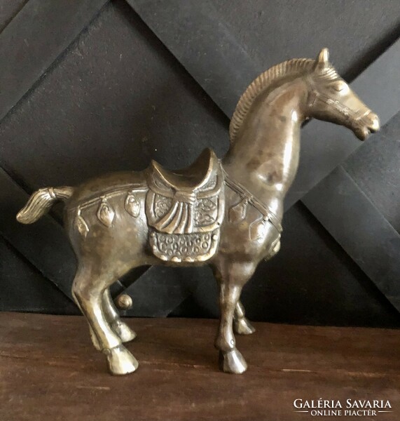 Metal horse statue with fine decoration
