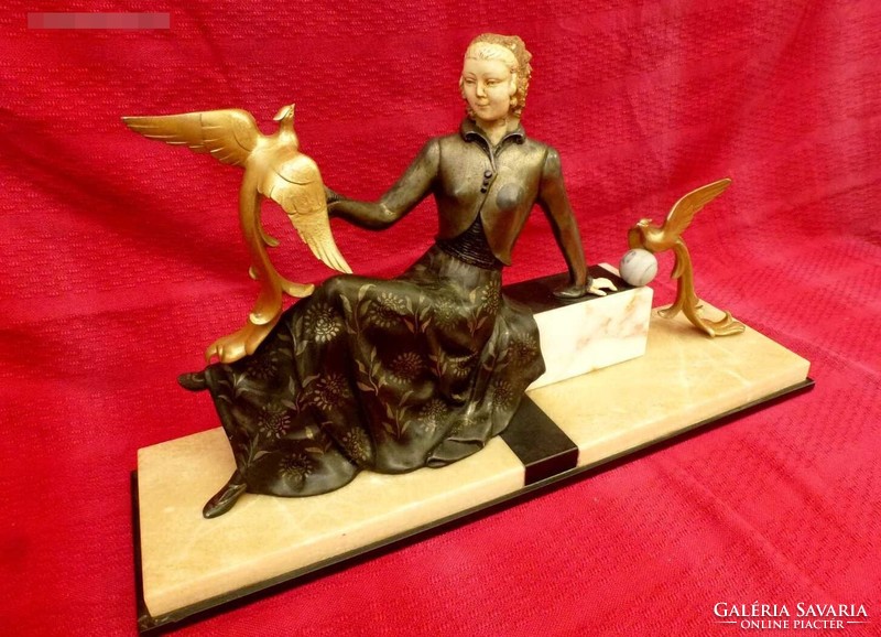 Art deco female figure with doves on marble. In good condition. Designed by Demetre chiparus