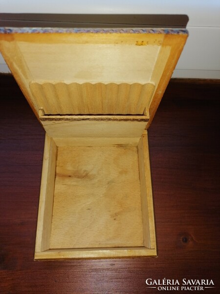 Old wooden box offering cigarettes