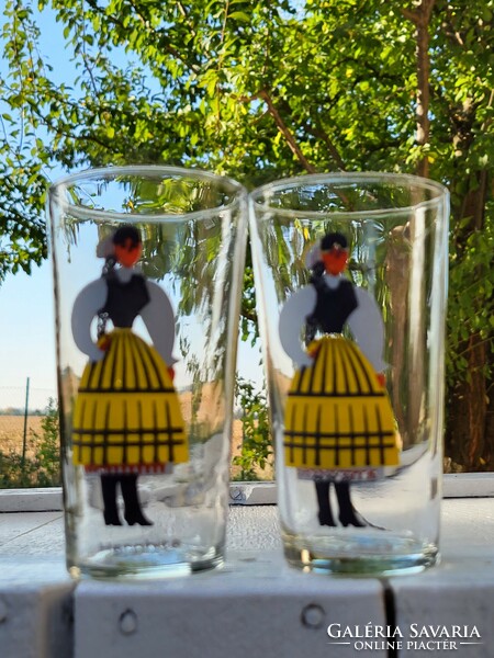 A pair of soft drinks and water glasses in the folk costume of Transylvania, Harghita
