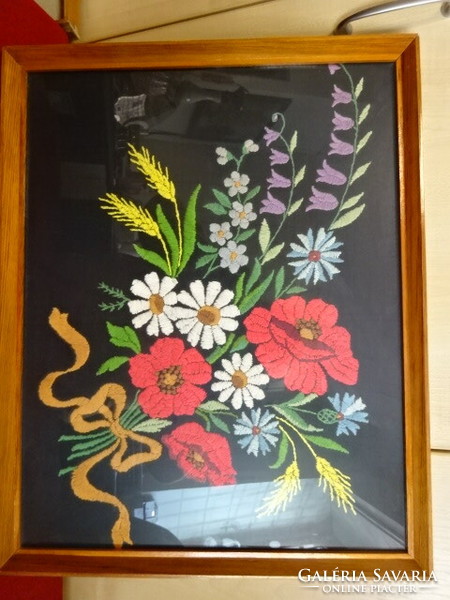 Embroidered wall picture. The base is black canvas, it depicts a spring bouquet, size: 47x37 cm. Jokai.