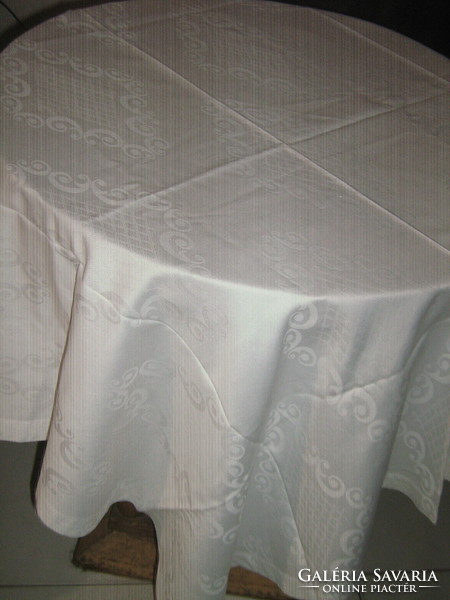 Beautiful white damask tablecloth with baroque pattern