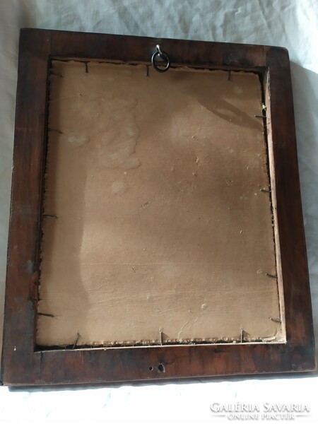 A small old mirror in a Biedermeier frame