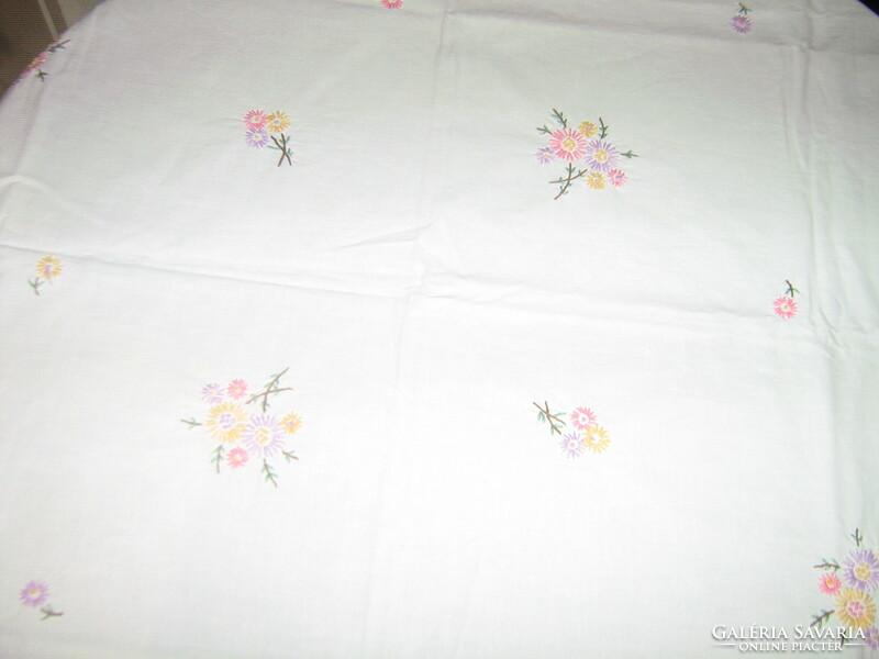 Beautiful hand-embroidered antique lace-edged vintage colorful floral needlework tablecloth