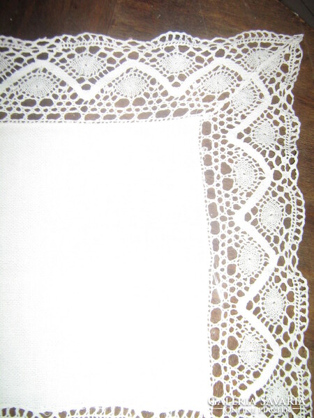 Beautiful white woven tablecloth with lace edges and inserts