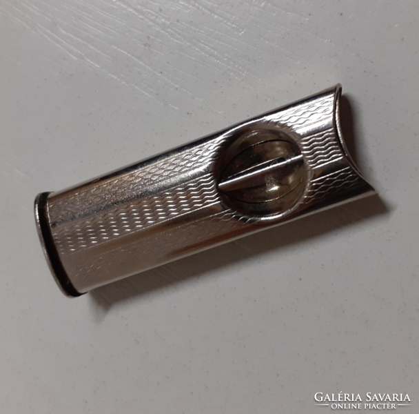 A cigar in good condition in a usable condition in its cutter case