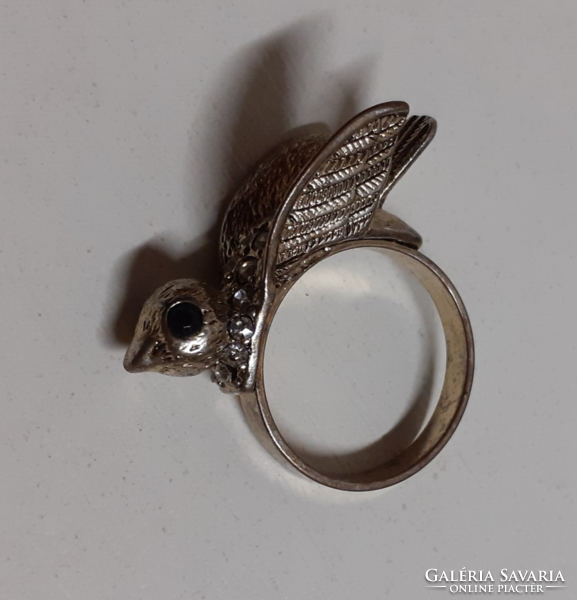 Nice condition gold-colored steel fashion ring with a large bird's head, studded with small white stones