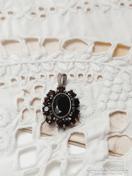 Antique marked pendant with garnet stones