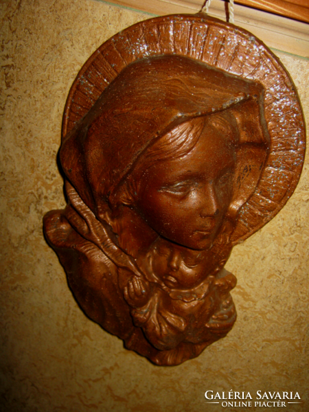 Handmade wax mary with the little one can be hung on the wall