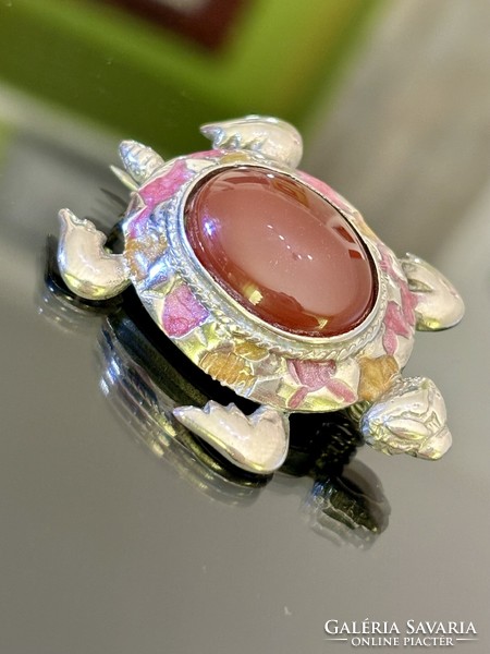 A stunning silver turtle brooch with a large carnelian stone
