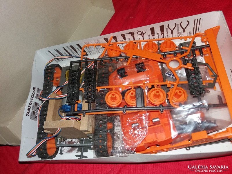 Old battery-powered Tamiya model bulldozer with box as shown in the pictures