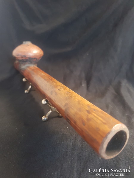 An opium pipe is an old piece, perhaps more than 100 years old