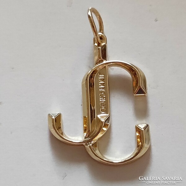 Original jimmy choo pendant worth 30,000.-