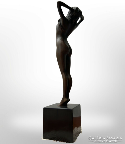 Female nude bronze statue on a granite plinth