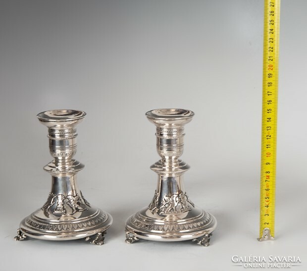Pair of silver candle holders - decorated with griffins