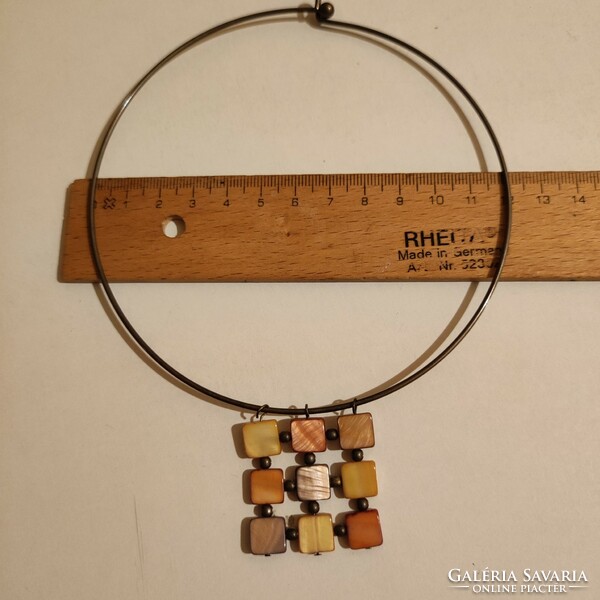Rigid neck strap with shell pendant