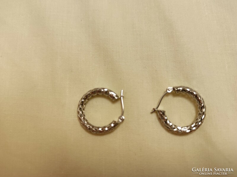 Silver hoop earrings with a beautiful engraved pattern