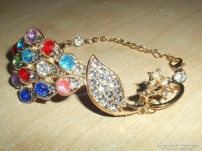 Bracelet with many stones in the shape of a peacock