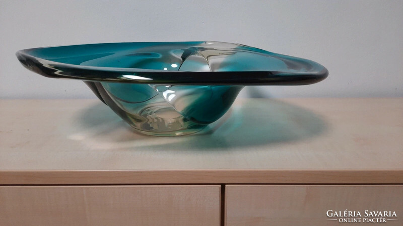 A large, heavy glass bowl