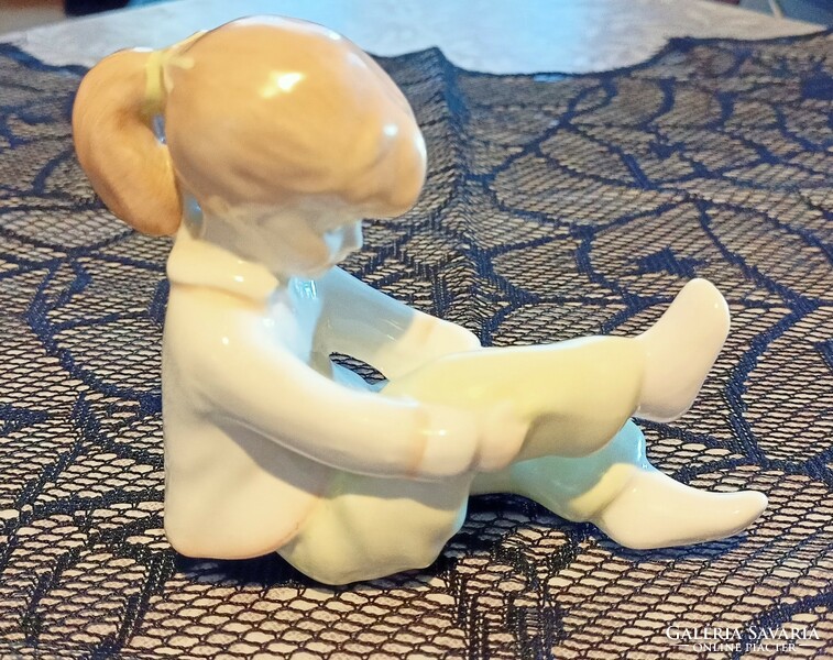 Aquincum porcelain figurine - little girl dressing up