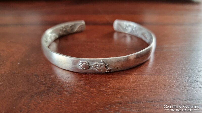 New, never worn handmade 999 silver bracelet with lotus pattern on the outside and inside