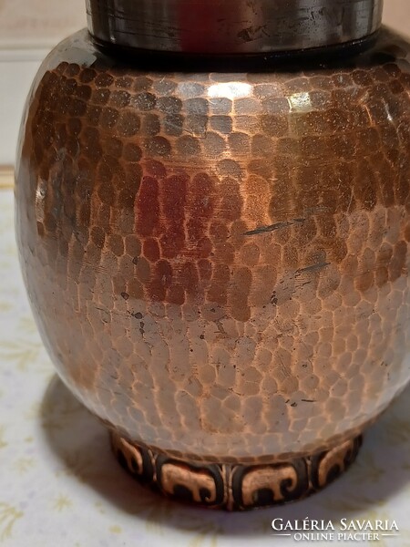 Industrial red copper vase with an elephant pattern